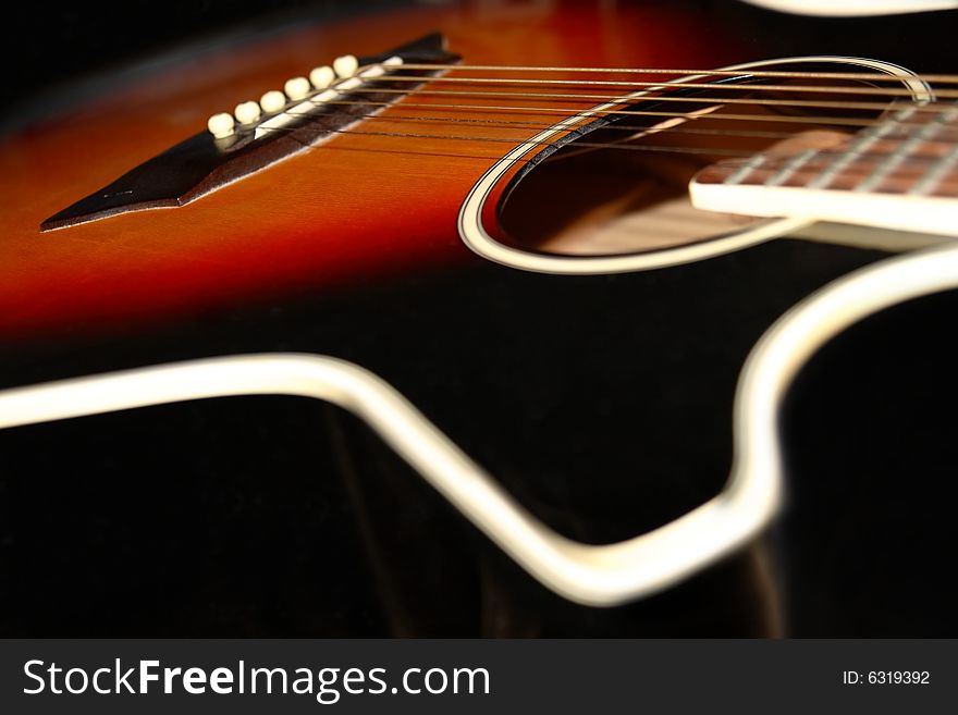 An abstract close up of an acoustic guitar. An abstract close up of an acoustic guitar