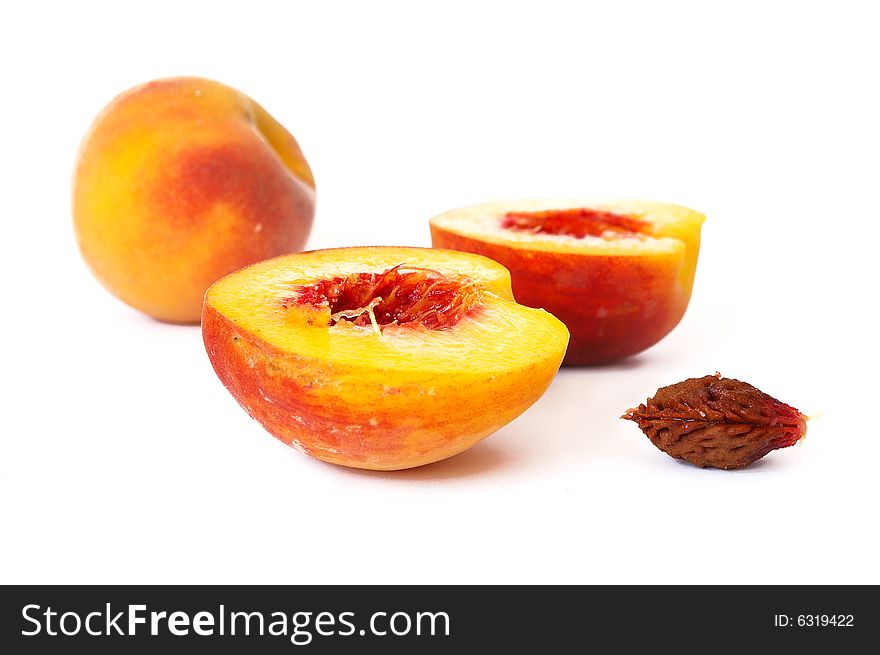 Ripe peach isolated on a white background
