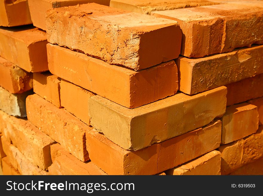 Pile of red cavity bricks