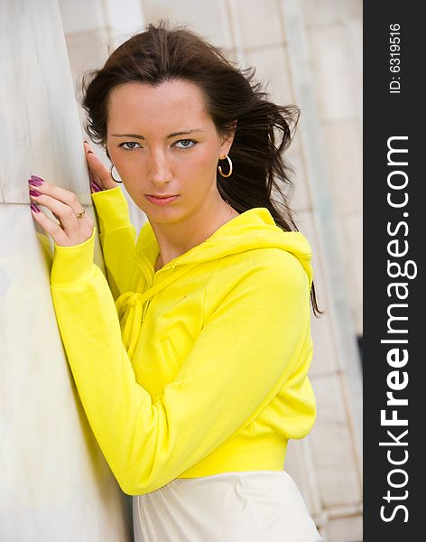 Portrait of a young cute woman dressed in yellow. Portrait of a young cute woman dressed in yellow