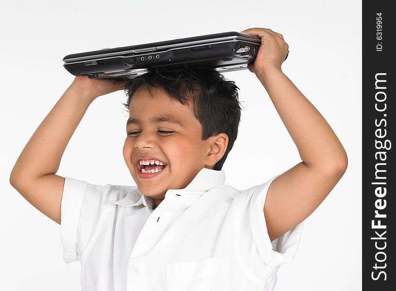 Asian boy holding laptop on his head