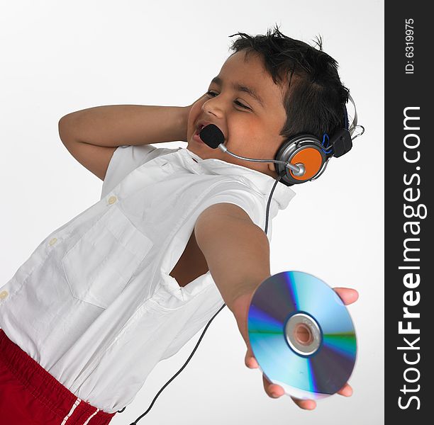 Asian boy holding cd with headphone