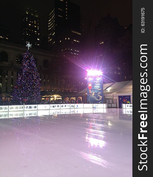 Ice Skating Rink at Bryant Park in the Evening in Manhattan, New York, NY. Ice Skating Rink at Bryant Park in the Evening in Manhattan, New York, NY.