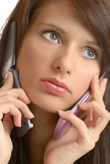 Girl With Two Telephones Royalty Free Stock Image