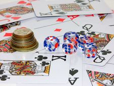 Coins, Playing Bones And Playing Cards Stock Photo