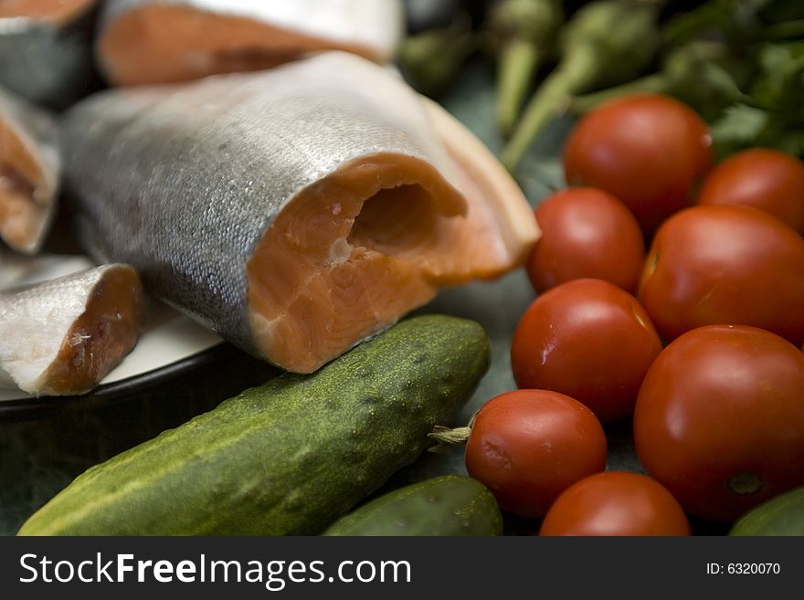 Fresh red salmon fish with vegetable cucumber and tomato