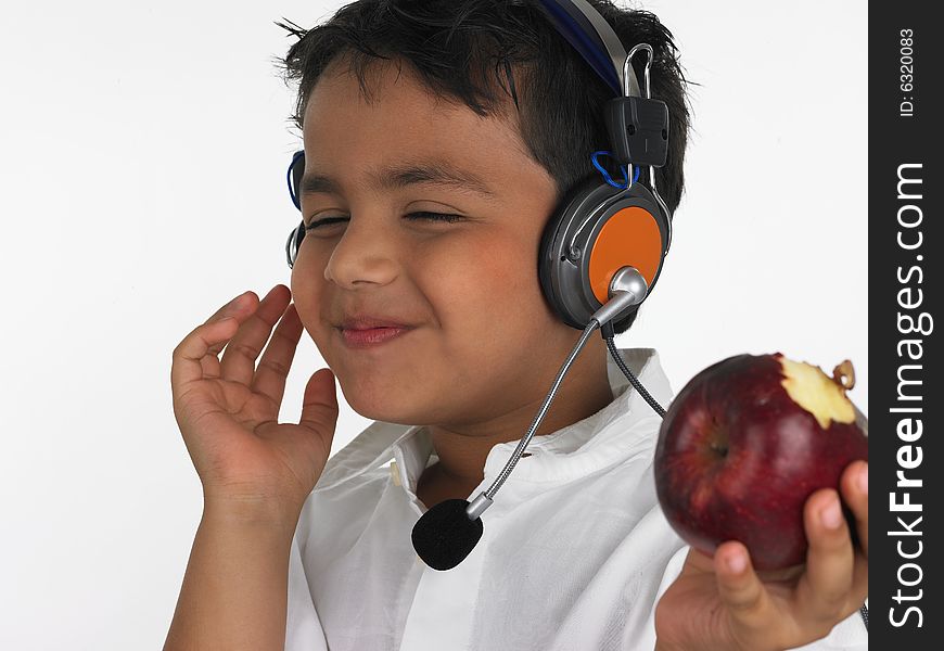 Asian boy biting an red apple