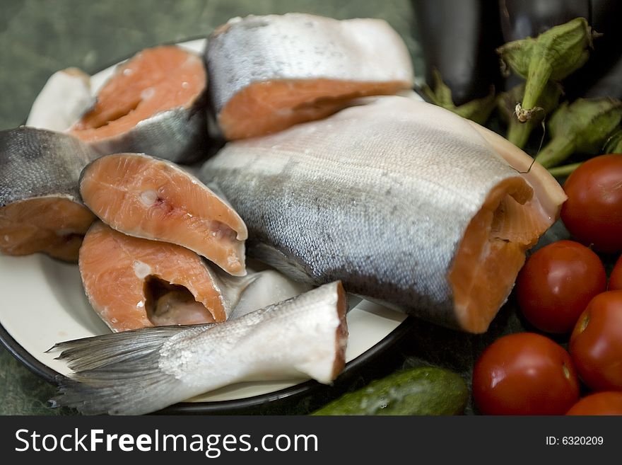 Fresh red salmon fish with vegetable cucumber and tomato