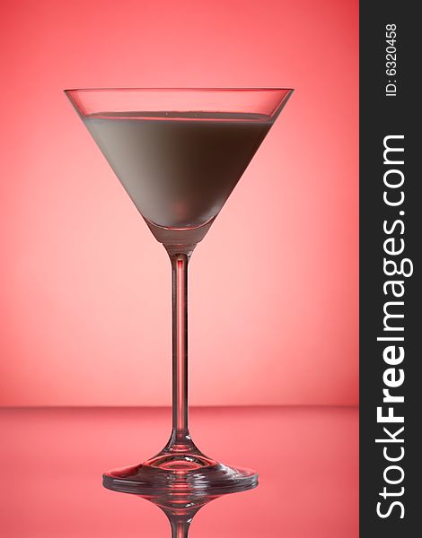 Milky cocktail on red background