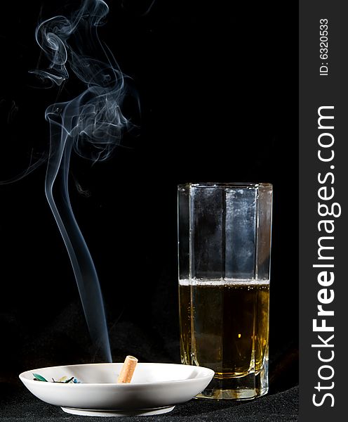 Cigarette smoke and beer drink. Cigarette smoke and beer drink