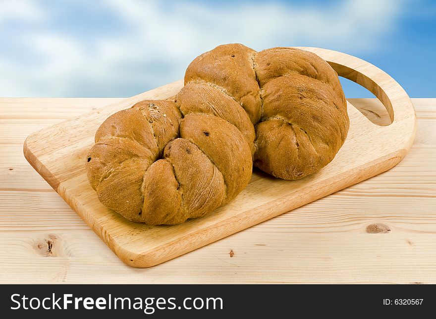 Root shaped bread on a cutting board. Root shaped bread on a cutting board