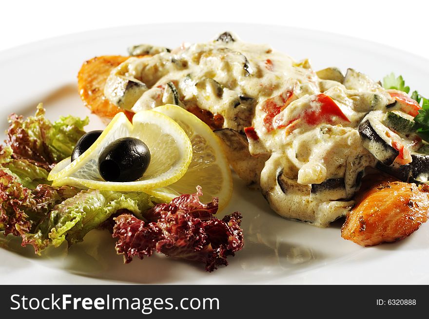 Salmon Steak Plate under Vegetable with Cream. Isolated on White Background. Salmon Steak Plate under Vegetable with Cream. Isolated on White Background