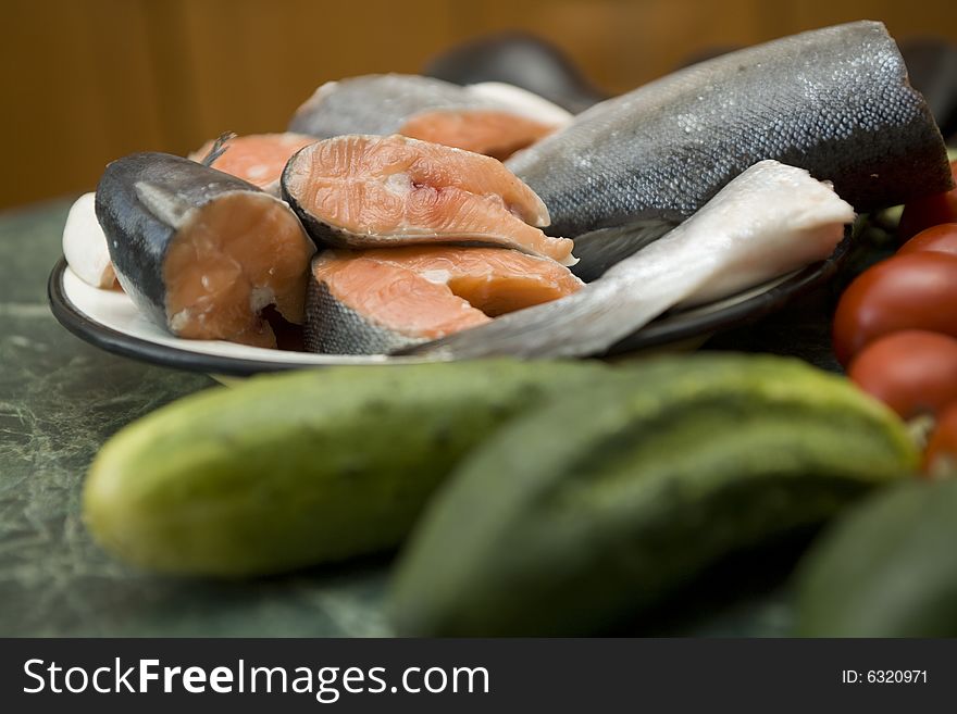 Fresh red salmon fish with vegetable cucumber and tomato