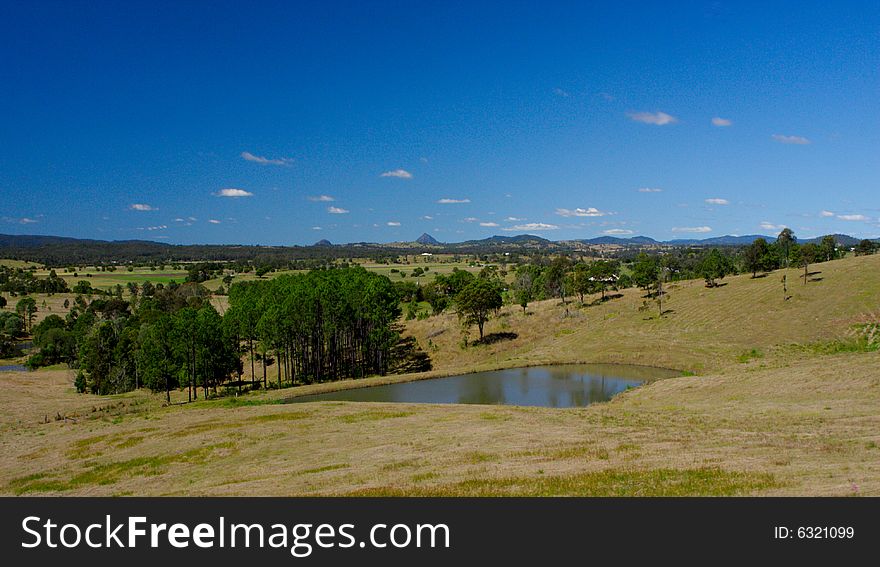 Lovely farm dam with blue cloudy sky. Lovely farm dam with blue cloudy sky