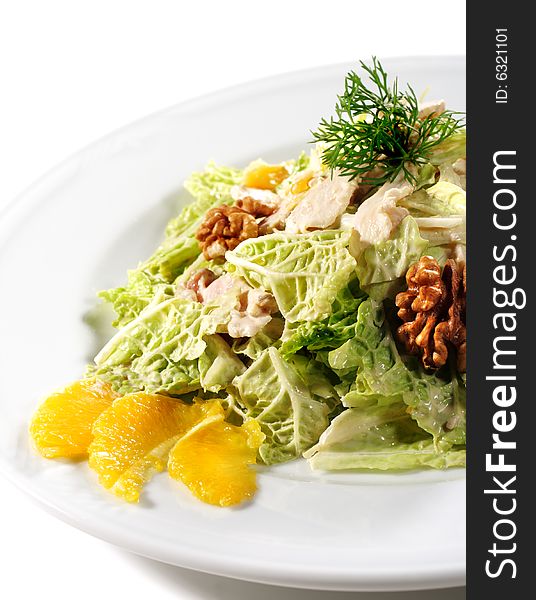 Salad with Chinese Cabbage and Chicken Filleted. Serve with Circassian Walnut and Orange. Isolated on White Background. Salad with Chinese Cabbage and Chicken Filleted. Serve with Circassian Walnut and Orange. Isolated on White Background