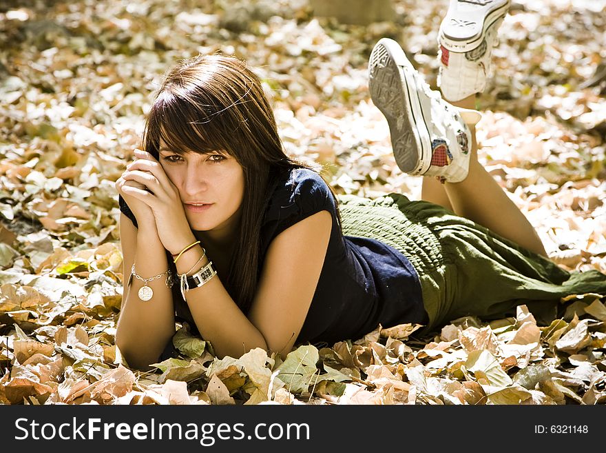 Young Woman In Autumn Background