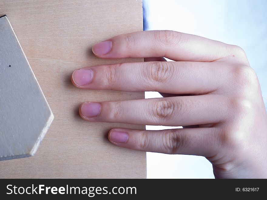 Close up observation of Female hand holding wooden mirror. Close up observation of Female hand holding wooden mirror