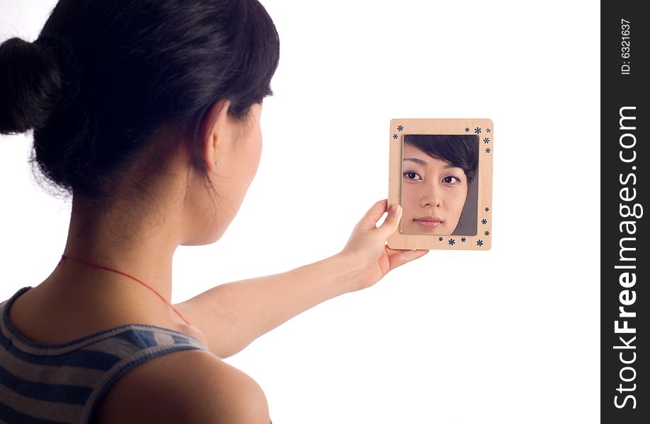 Love lady looking at mirror with wooden boarder. Love lady looking at mirror with wooden boarder