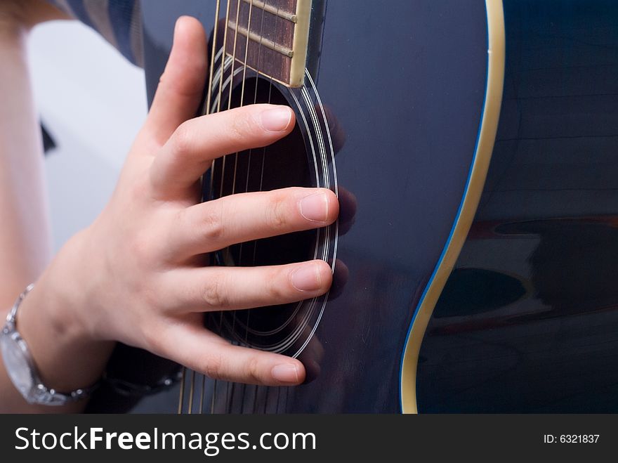 Female hand with classical antique wooden guitar. Female hand with classical antique wooden guitar