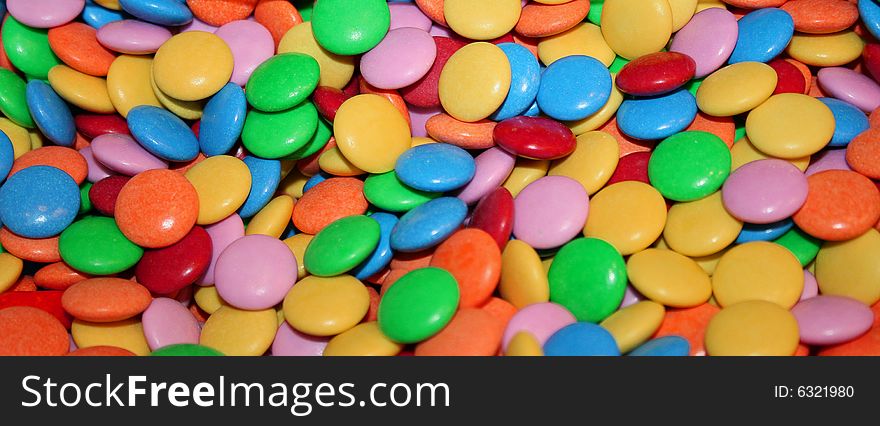 Sweet multicolored chocolate abstract background. Sweet multicolored chocolate abstract background