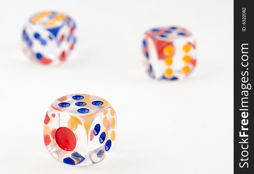 Still life of three plastic dice on white background. Still life of three plastic dice on white background