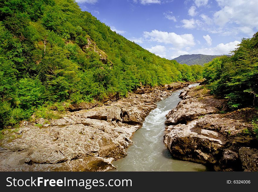 Cold mountain river in summer