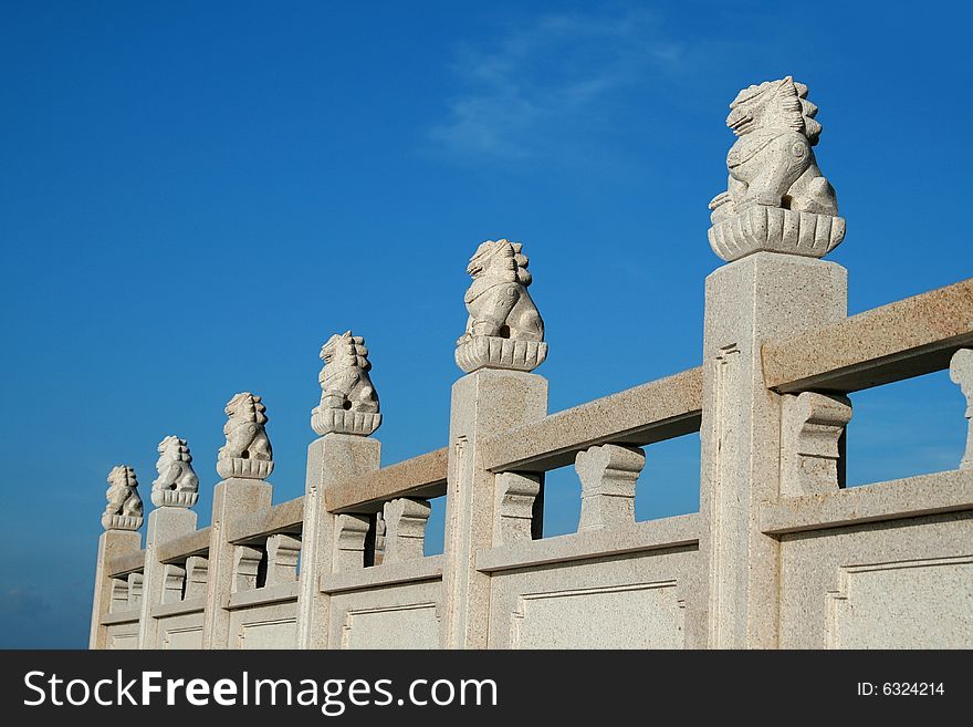 Chinese stone lion in the blue sky.