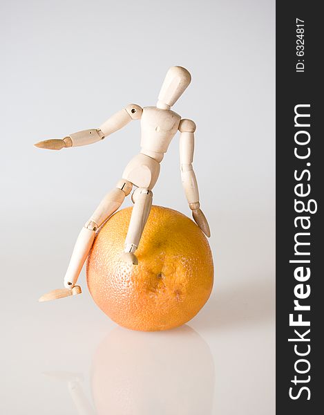 The dummy sits astride a grapefruit. The dummy sits astride a grapefruit
