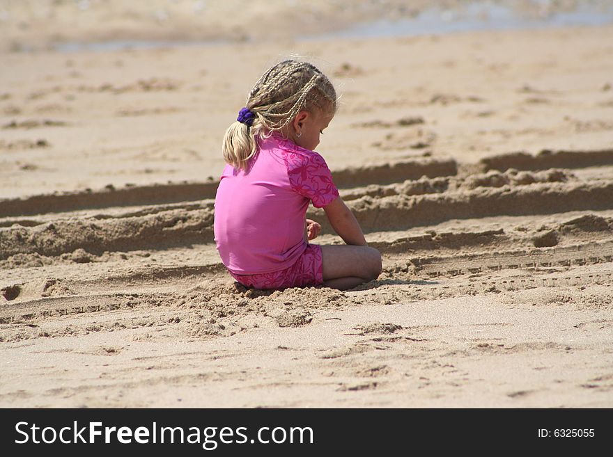 Little Girl On The Beach