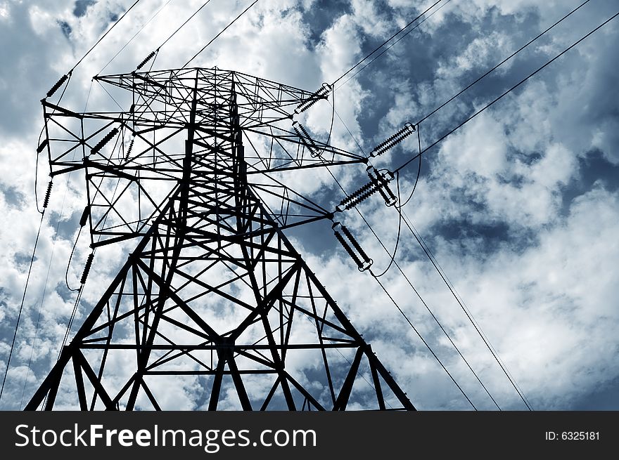 Electrical pylon and power lines with a cloudy sky. Electrical pylon and power lines with a cloudy sky.
