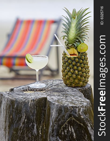 Pineapple, cocktail on the beach for the diversion on vacation