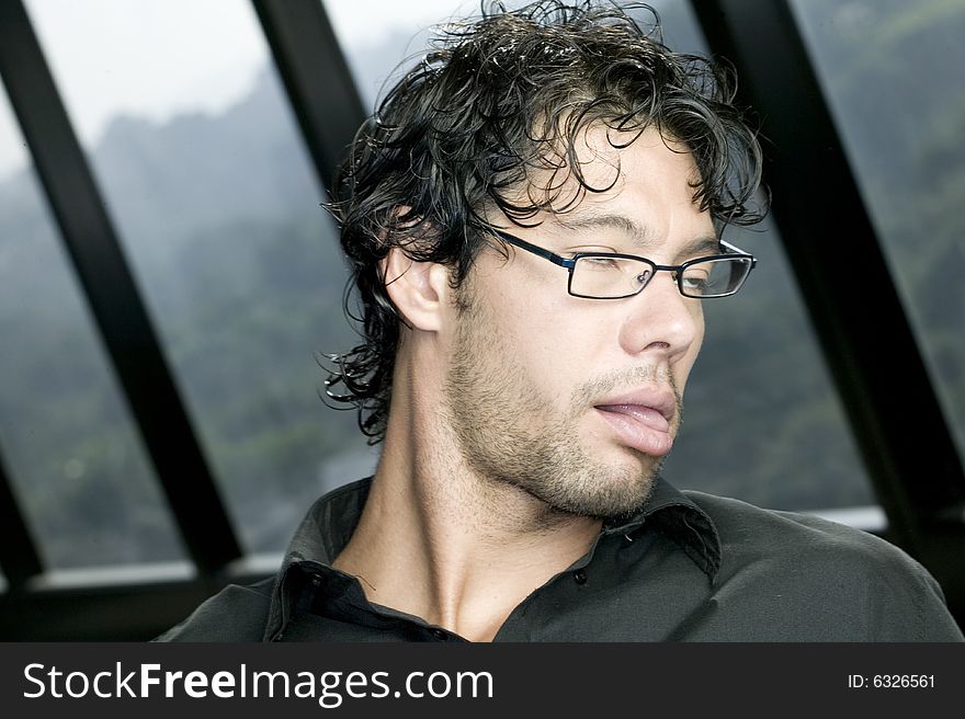 Young man with glasses making a funny face. Young man with glasses making a funny face