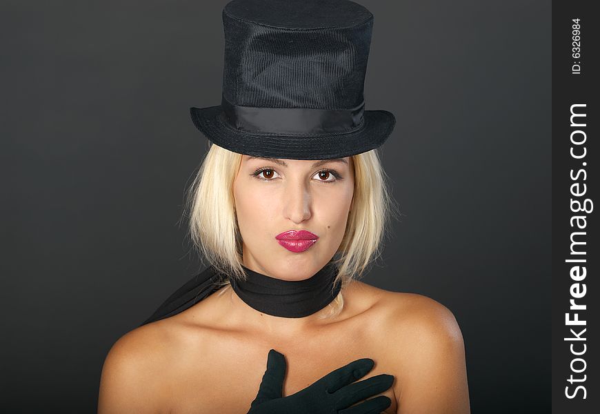 Blonde Woman In Black Hat And Scarf.