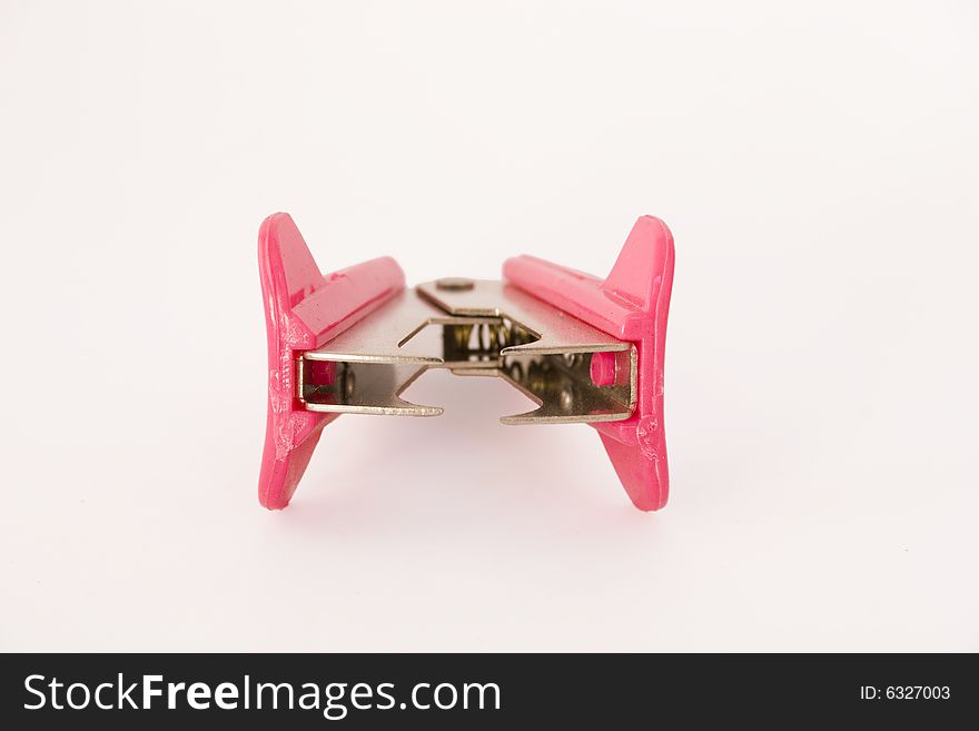 Front view of pink staple remover isolated on white background. Front view of pink staple remover isolated on white background