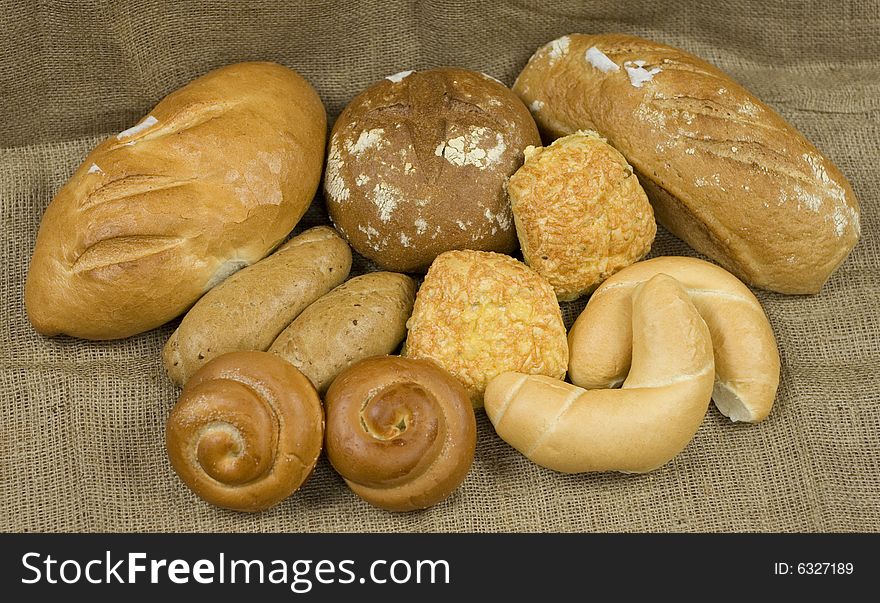 Assortment of different baked bread and natural backdrop. Assortment of different baked bread and natural backdrop