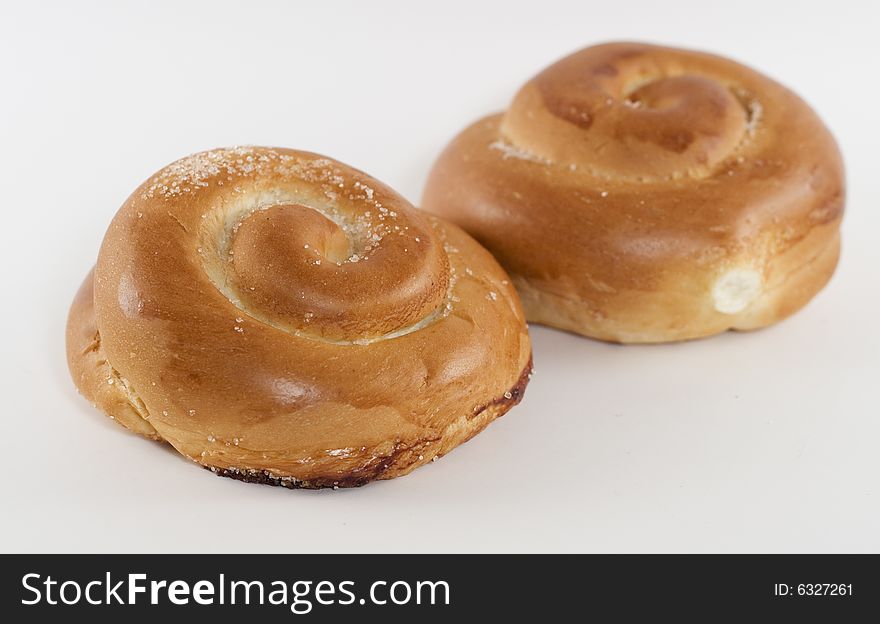 Two rolled sweet buns with white background