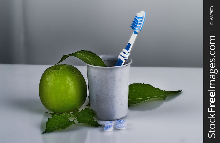 Toothbrush and apple, close up shot. Toothbrush and apple, close up shot