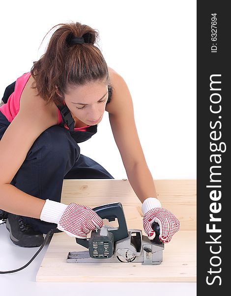 Woman carpenter at work on white background