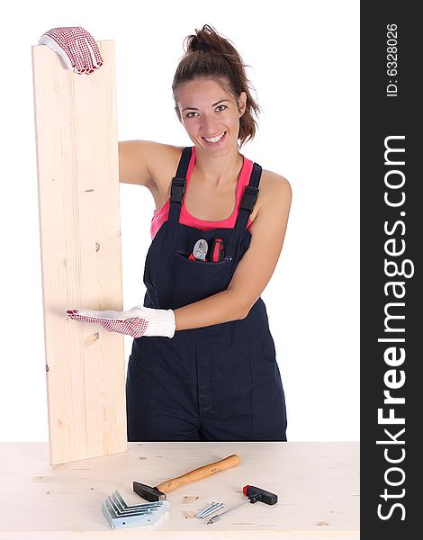 Woman carpenter holding wooden plank on white background