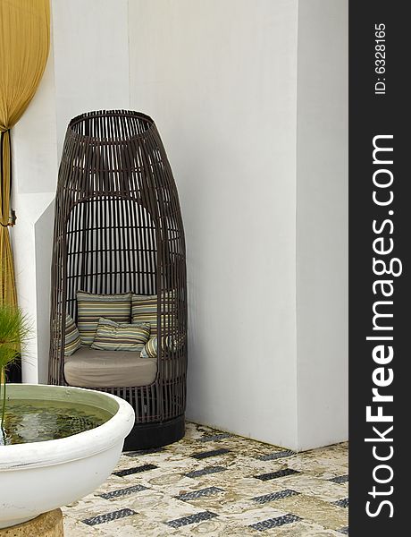 Comfortable Wicker Chair with Soft Pillows. Comfortable Wicker Chair with Soft Pillows