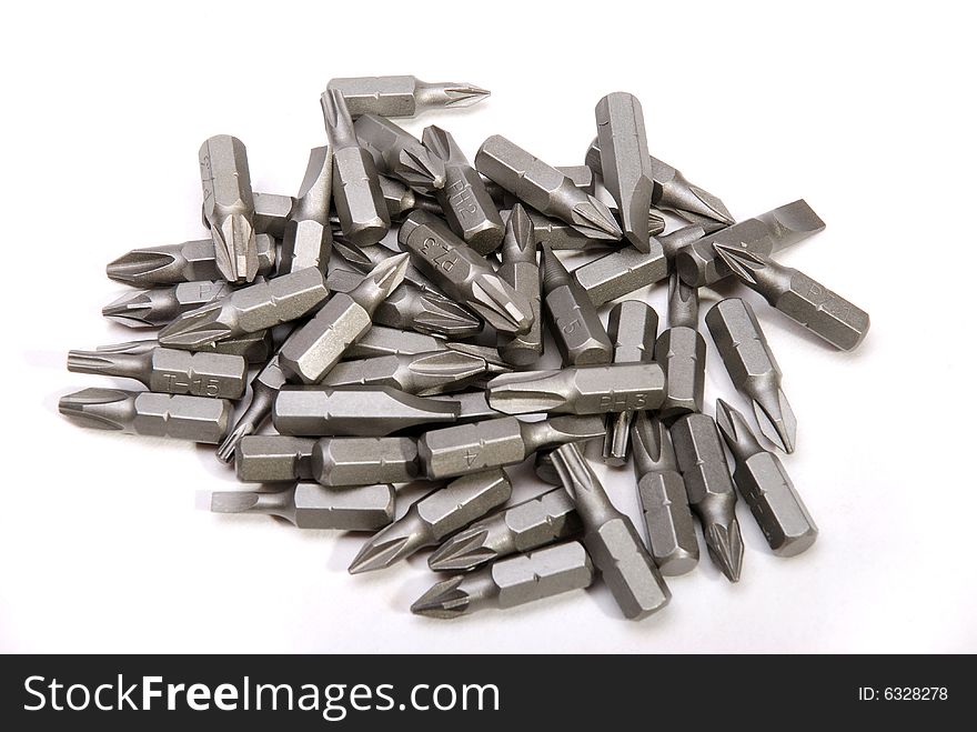 Drill bits on a white linen background, numbered in size. Drill bits on a white linen background, numbered in size.