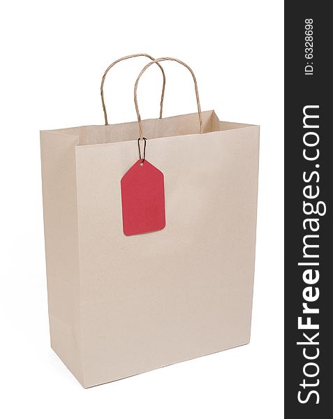 Shopping bag isolated on white with red tag. Shopping bag isolated on white with red tag