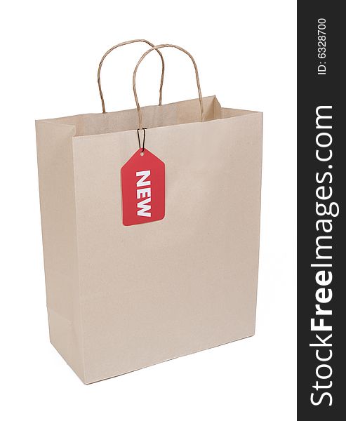 Shopping bag isolated on white with red NEW tag. Shopping bag isolated on white with red NEW tag