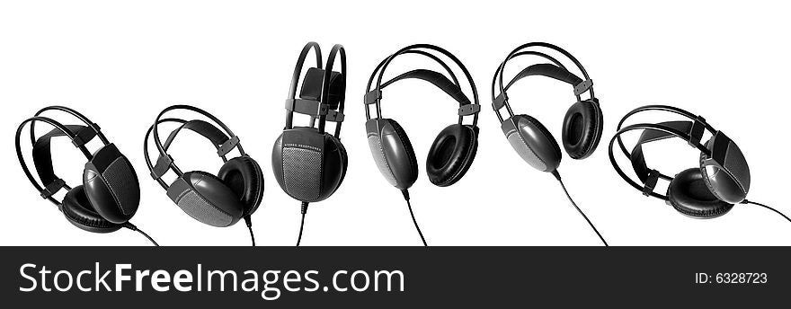 Six big black headphones on a white background