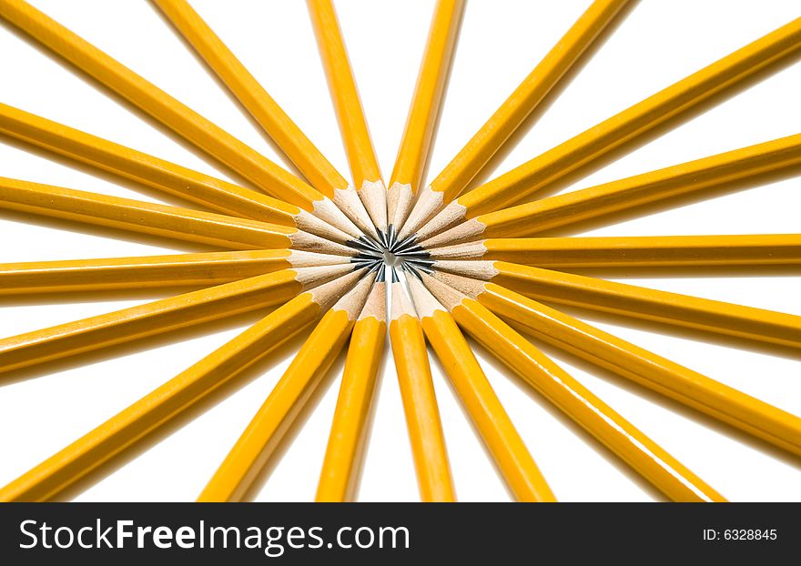 Vibrant Ring of Yellow Pencils arranged in a circle pattern like the spokes of a tire