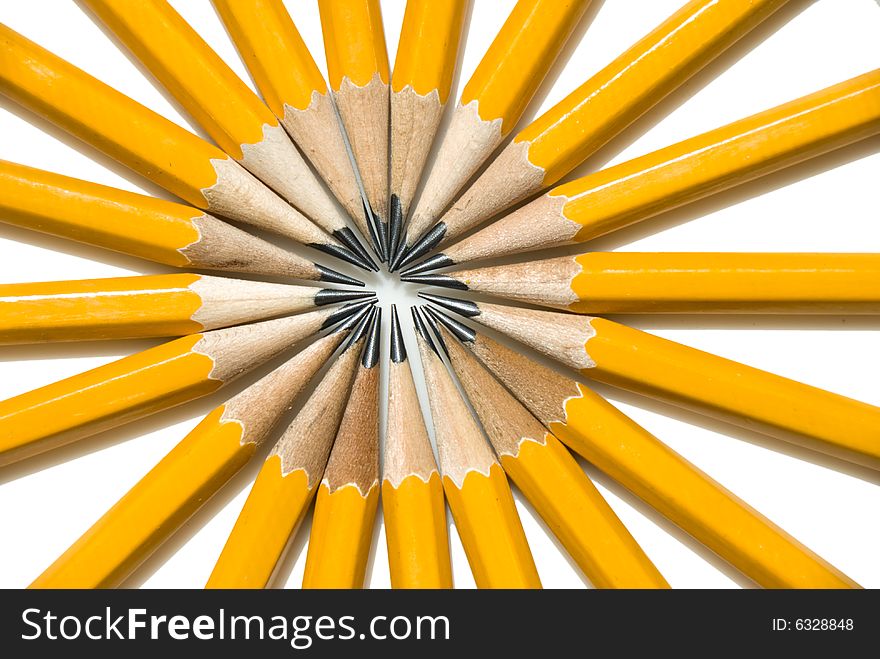 Vibrant Ring of Yellow Pencils arranged in a circle pattern like the spokes of a tire. Vibrant Ring of Yellow Pencils arranged in a circle pattern like the spokes of a tire