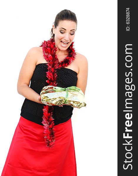 Isolated Christmas portrait of a happy woman with a gift.