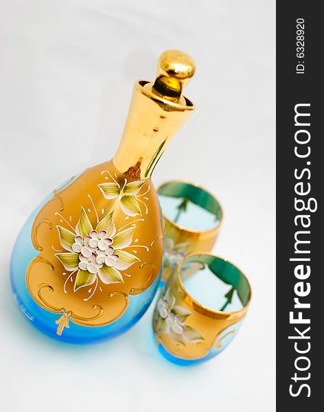 Glass jug and goblets handmade in Venice. Light blue tints with floral and gold leaf adornments. Glass jug and goblets handmade in Venice. Light blue tints with floral and gold leaf adornments.