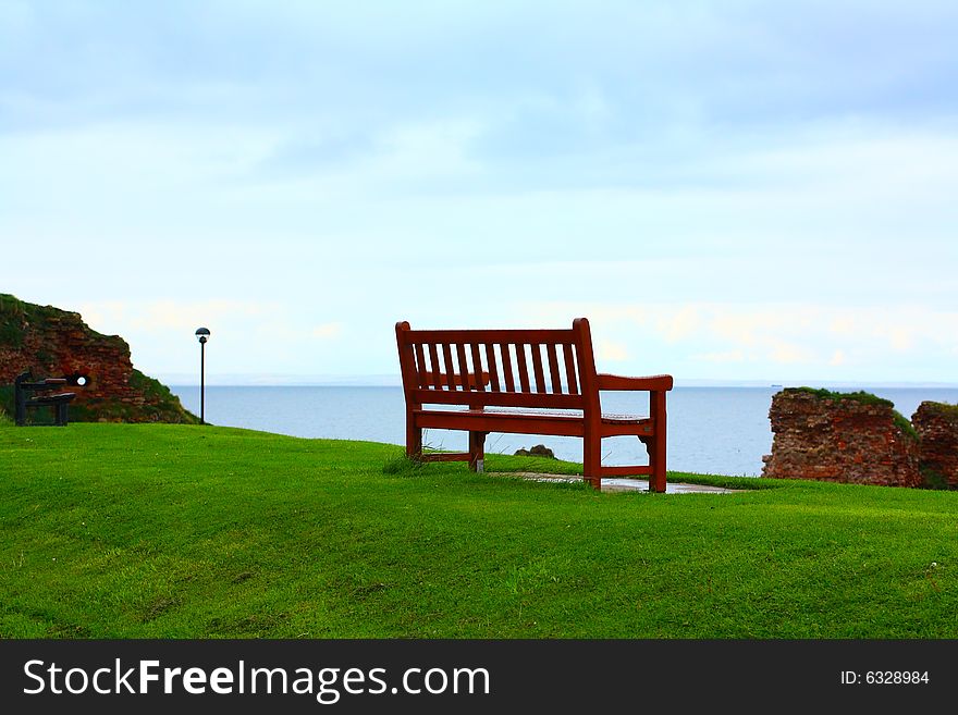 An empty bench at the seaside in Dunbar, Scotland