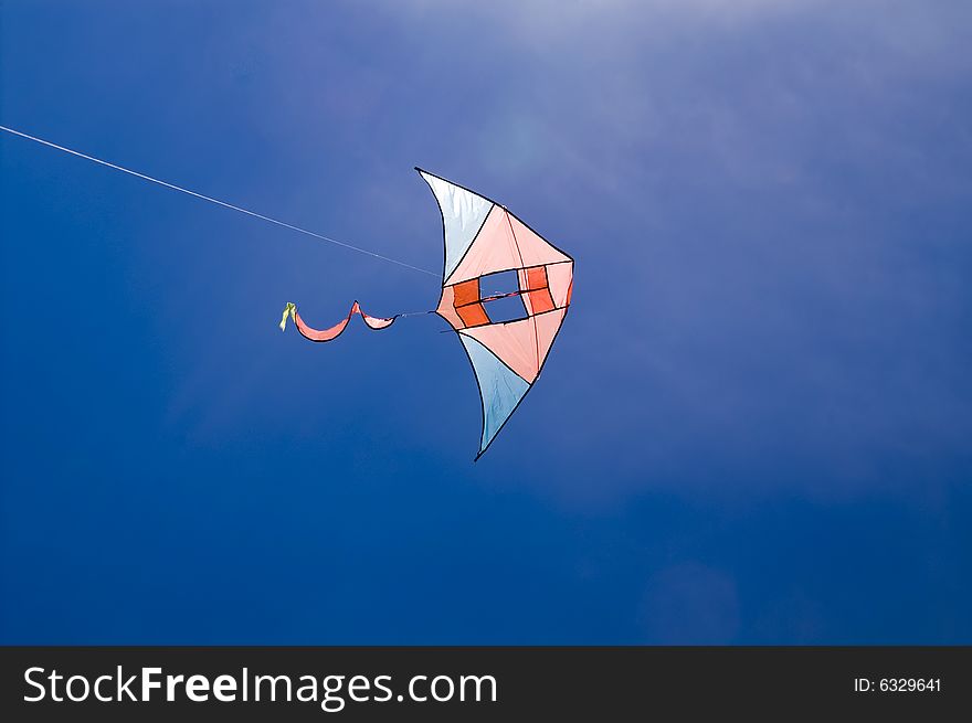 Kite in the blue sky (summer background)